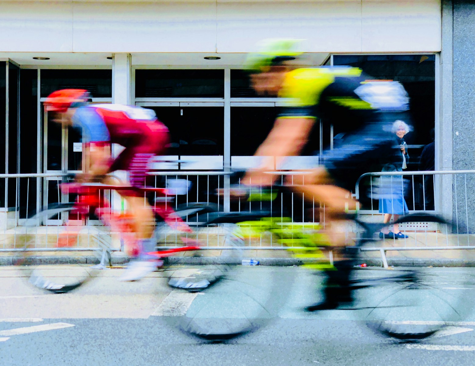 time lapse photography of two bikers cycle racing